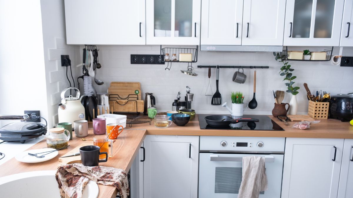 A cluttered kitchen filled with disorganized items, highlighting the need for post-holiday renovation tips for homeowners.