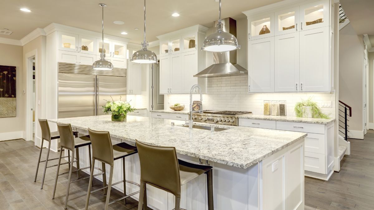 Bright kitchen with white cabinetry and an island, ideal for starting your Los Angeles kitchen remodel in 2025.