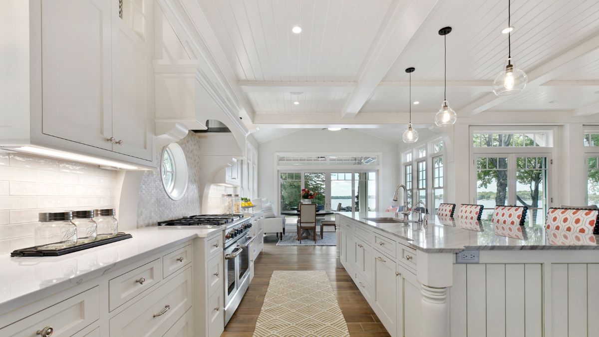 A modern kitchen featuring white cabinets and a central island, exemplifying stylish and functional design for a remodel.